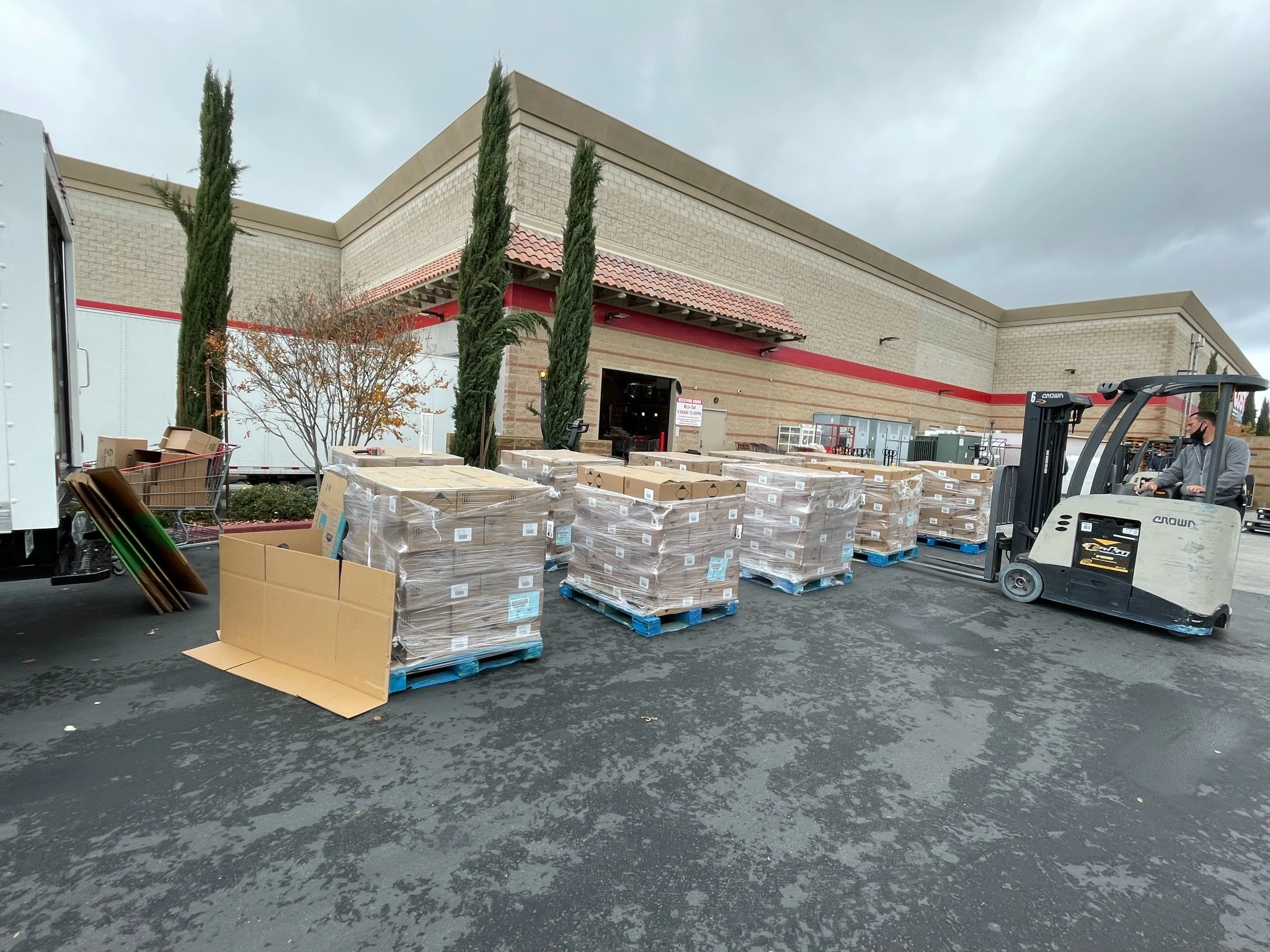 Forklift moving palletized wholesale inventory